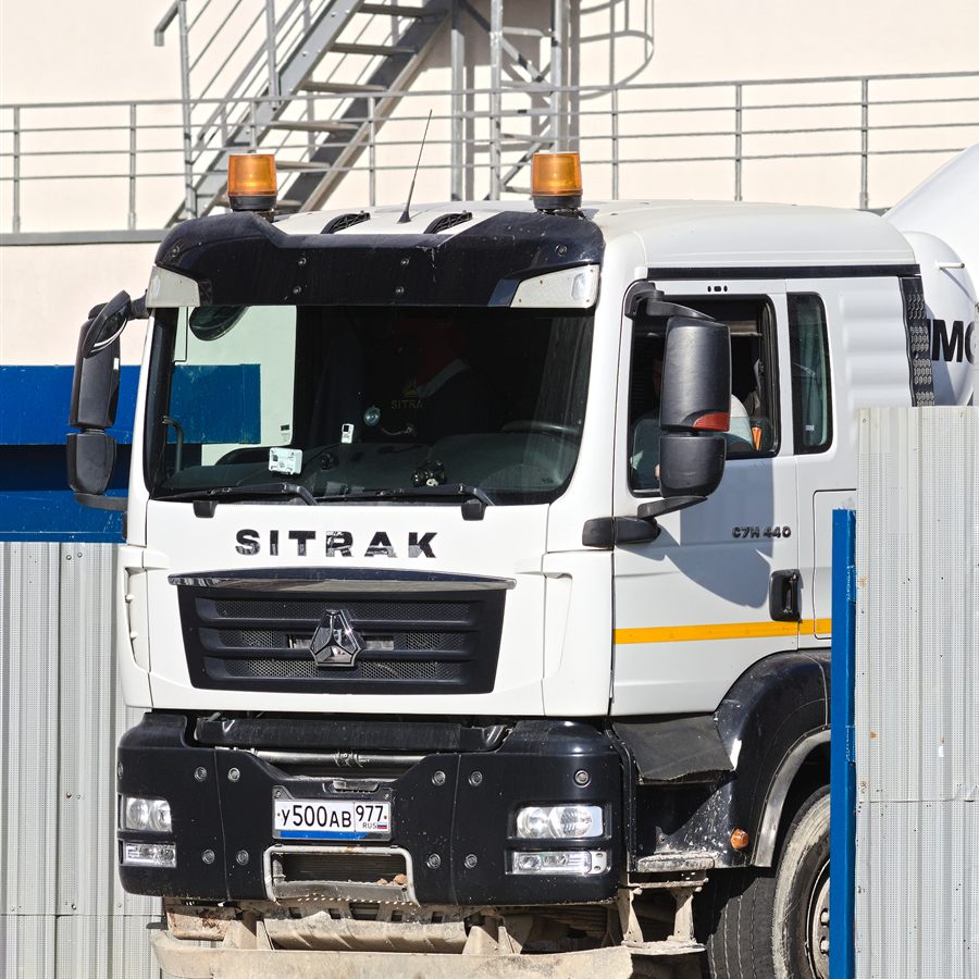 Concrete transit mixer truck leaving a site